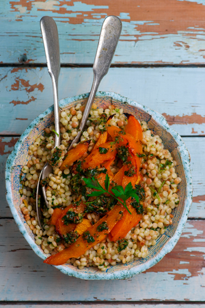 fregola sarda with caramelized squash and charmoula. selective focusの写真素材