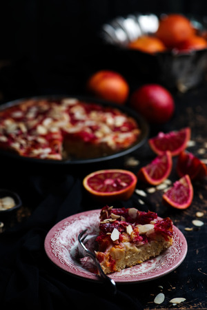 blood orange almond cake.dark photo.vintage style.selective focusの写真素材