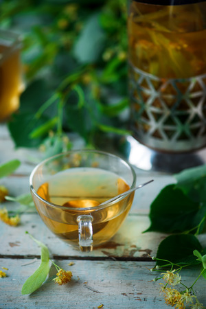 LINDEN BLOSSOM  tea  in a  glass cup. selective focusの写真素材