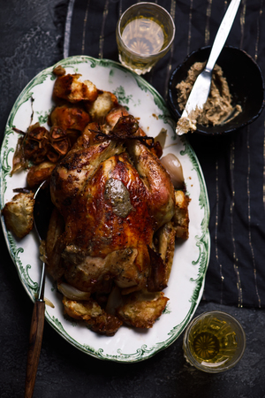 Roasted chicken with anchovy butter..style rustic.selective focusの写真素材