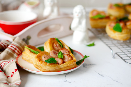 Puffs with sausages in heart shapes. Valentine's Day Breakfast.
 selective focusの写真素材
