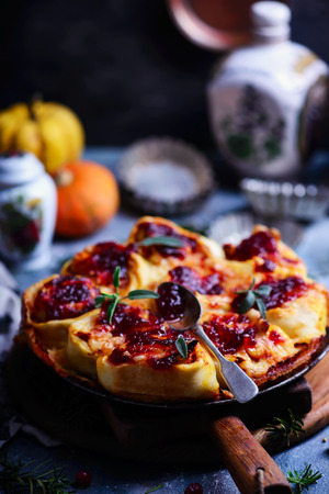 Pumpkin, Brie, and Caramelized Onion Rolls with Cranberry Glaze. style rustic. selective focusの写真素材