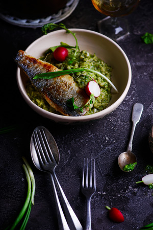 risotto with wild garlic and sea bass.の写真素材