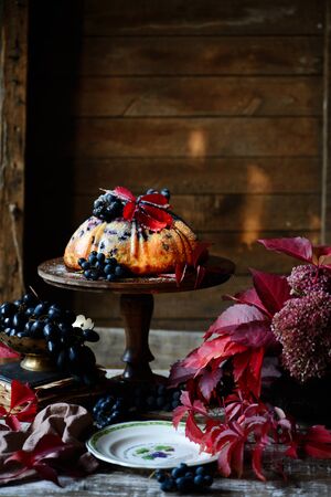 Grape bund cake with autumn decor. .style rustic. selective focusの写真素材