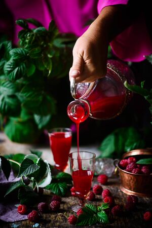 raspberry liquor. in the glasses .style rustic. selective focusの写真素材