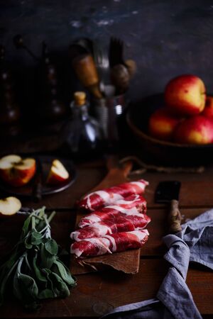 The cut a sausage on a cutting board . Style vintage. Selective focusの写真素材