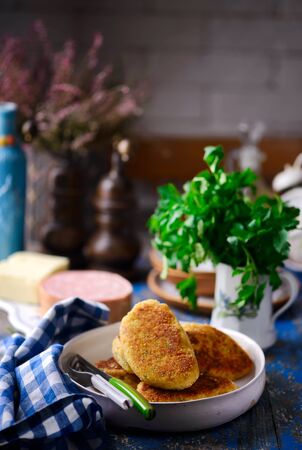 potato patties with mortadella and mozzarella. style rustic. selective focusの写真素材