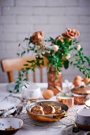 Cottage cheese pancakes with cream sauce.style rustic.selective focus