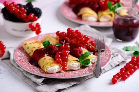 Crepes with lemon cream and raspberry jam..selective focus. style vintageの写真素材