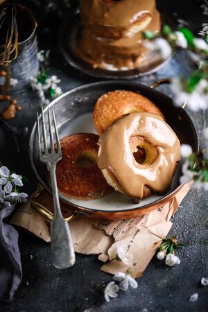 Glazed tres leches donuts..style vintage.selective focus