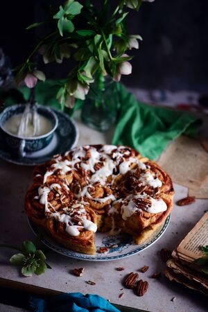 Carrot Cake Cinnamon Rolls with Cream Cheese Frosting..vintage style.selective focus