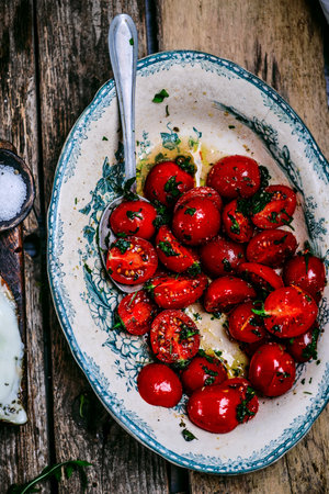 Tuscan steak with fried eggs and cherry tomatoes.style rustic.selective focusの写真素材