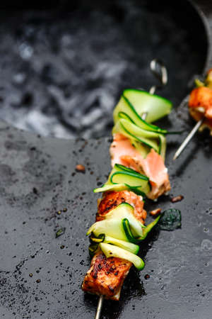 Salmon and zuccini kebab on the grill.style rustic.selective focusの写真素材