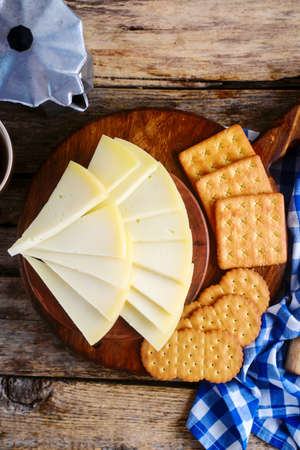 cheese on the cutting board .style rustic.selective focus