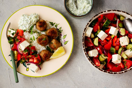 Greek style meatboll with rice and salad and tzatziki.selective focusの写真素材