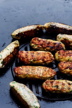 Chicken Lula Kebab with vegetables on the outdoor grill. .selective focus