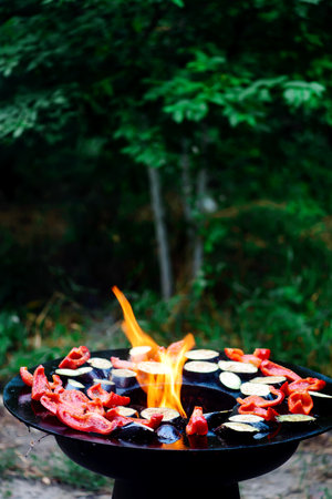 Grilled veal tongue with vegetables on the outdoor grill .selective focusの写真素材