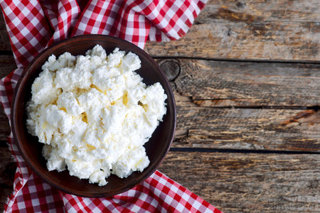 Homemade cottage cheese in a ceramic bowl for breakfast. selective focus.top veiwの写真素材