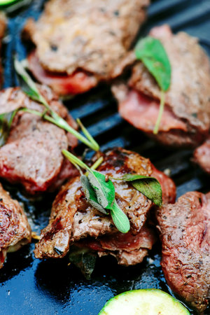 GGrilled veal picatta with vegetables on the outdoor grill .selective focusの写真素材