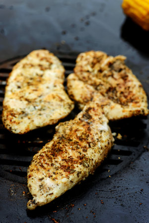 Chicken bruscetta with vegetables cooking on an outdoor grill .selective focusの写真素材