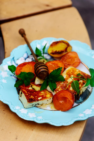 Halloumi cheese with apricots on an outdoor grill.selective focusの写真素材