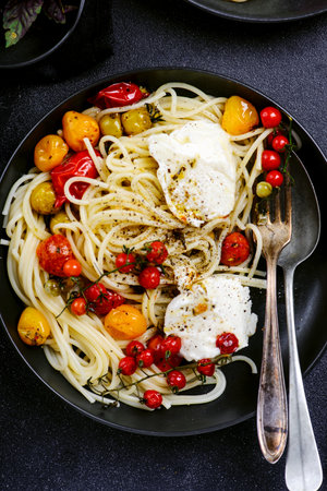 Spaghetti with baked tomatoes and burrata.Style hugge.selective focusの写真素材