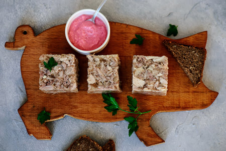 Jellied meat with horseradish on a wooden board. style hugge. selective focus