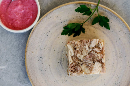 Jellied meat with horseradish on a wooden board. style hugge. selective focus