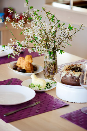 Butter in the shape of a lamb on a set Easter table. style rustic.selective focus