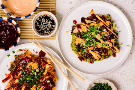 Okonomiyaki. Japanese vegetable pancakes.selective focus