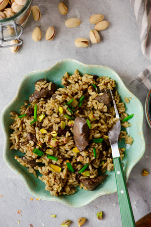 Turkish pilaf with chicken liver and pistachios.top veiw .selective focusの写真素材