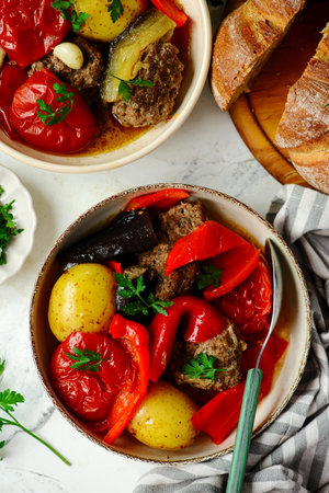 Cutlets with vegetables in a cauldron in Azerbaijani style.top veiw .selective focusの写真素材