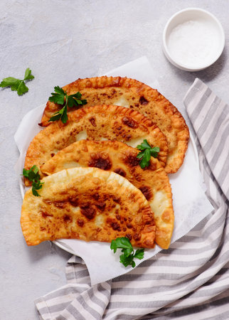 Chebureki on white plate. style huge. top view. selective focusの写真素材