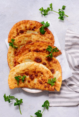 Chebureki on white plate. style hugge. top veiw. selective focus