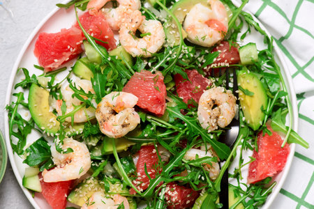 Healthy, fresh salad with shrimp, avocado, arugula in grapefruit.selective focus.top veiwの写真素材