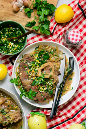 Traditional Italian Ossobuco with Gremolata and polenta in a bowl.top veiw.style hugge. Selective focusの写真素材