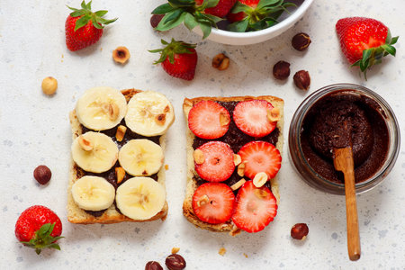 Brioche slices with homemade Nutella, strawberries and bananas.top veiw .selective focusの写真素材