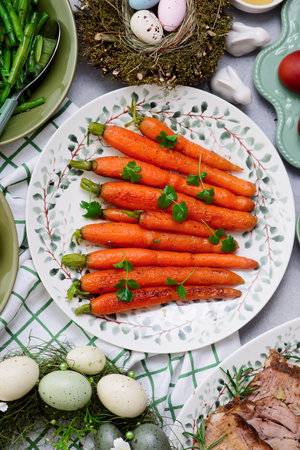 Easter baked carrots, green beans and boiled potatoes.top view.selective focus