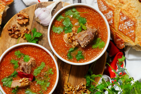 Traditional Georgian soup kharcho with walnuts. top veiw. selective focus