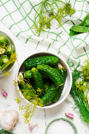 Homemade lightly salted cucumbers, pickled with dill umbrellas and garlic in glass jar. top veiw .selective focusの写真素材