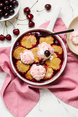 Cherry Cobbler with Honey Butter Vanilla Bean Biscuits in pan.top veiw.selective focusの写真素材