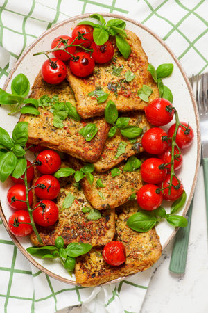 Easy Savory French Toast with Roasted Cherry Tomatoes and Basil..top view.selective focusの写真素材
