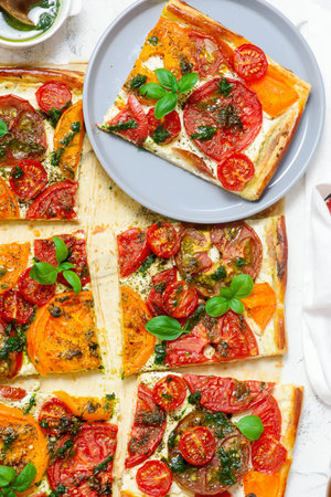 Cheese tomato and pesto tart.style rustic.selective focusの写真素材