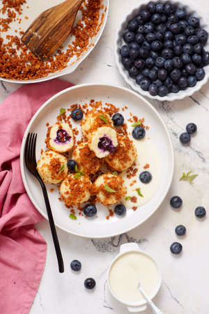 Blueberry curd dumplings with butter and cinnamon crumbs.の写真素材