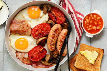 TRADITIONAL ENGLISH BREAKFAST WITH BUTTERED TOAST.TOP VEIW.selective focusの写真素材