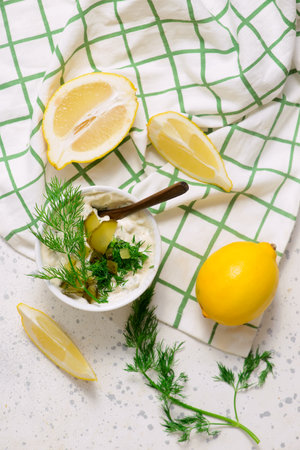 Tartar sauce with pickled cucumbers and dill in a bowl. top veiw.selective focusの写真素材