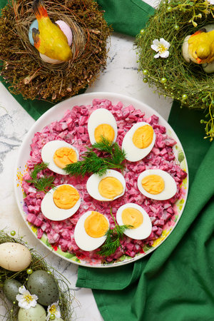 Easter boiled eggs on beetroot dip. A traditional Polish appetizer on Easter background..top...