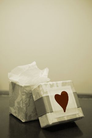 open gift box on tabletop with a heartの写真素材