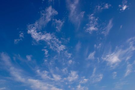 wispy clouds in a blue sky