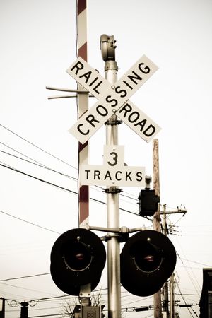 Faded railroad crossing signs and lightsの写真素材